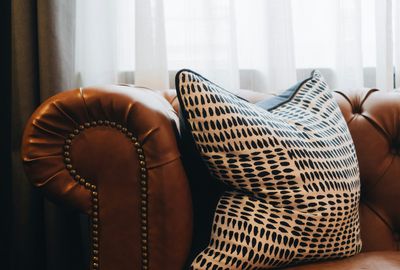 sofa with brown leather upholstery