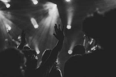 Raised hand in live concert crowd